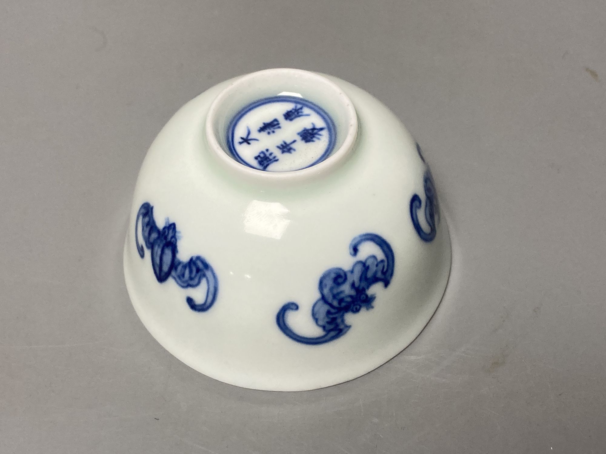 A Chinese blue and white 'five bat' tea cup, Kangxi mark but later, diameter 8cm
